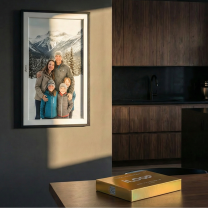 Modern kitchen with wooden cabinets and a iLoop framed family photo on the wall. 