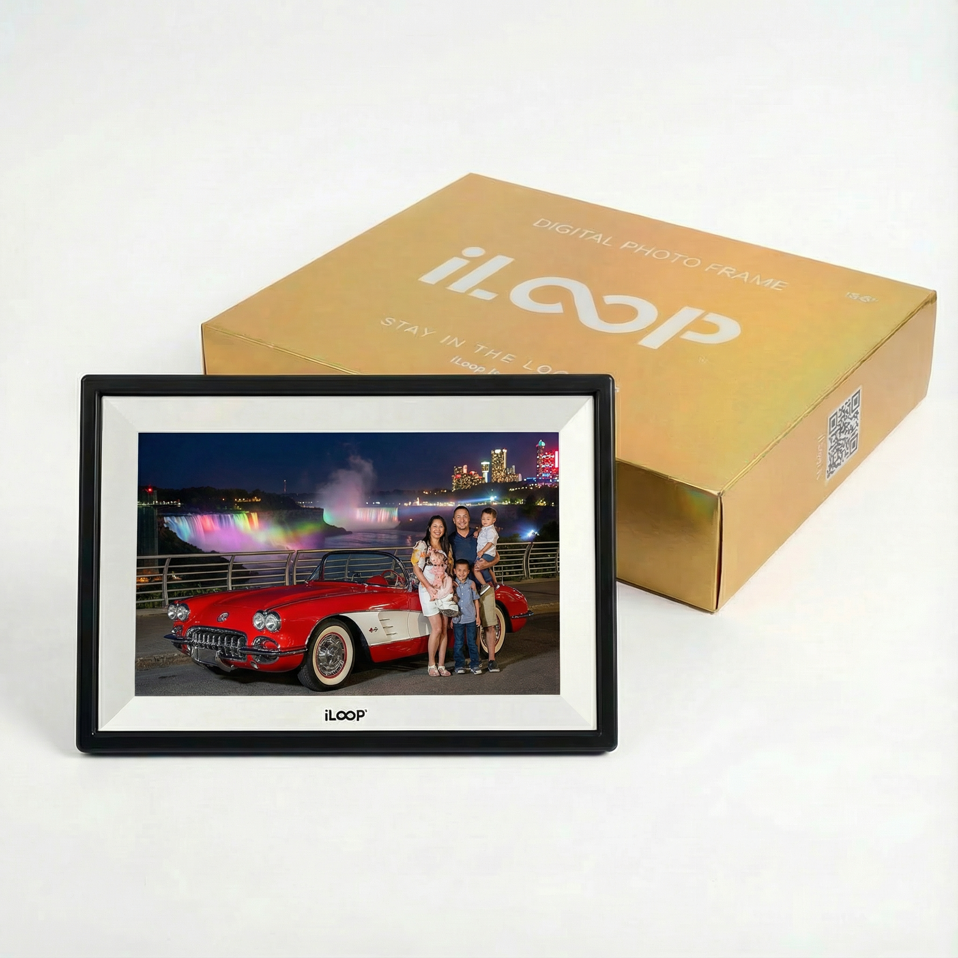 iLoop Digital photo frame with a family photo of a red car and Niagara Falls in the background, next to its packaging box.